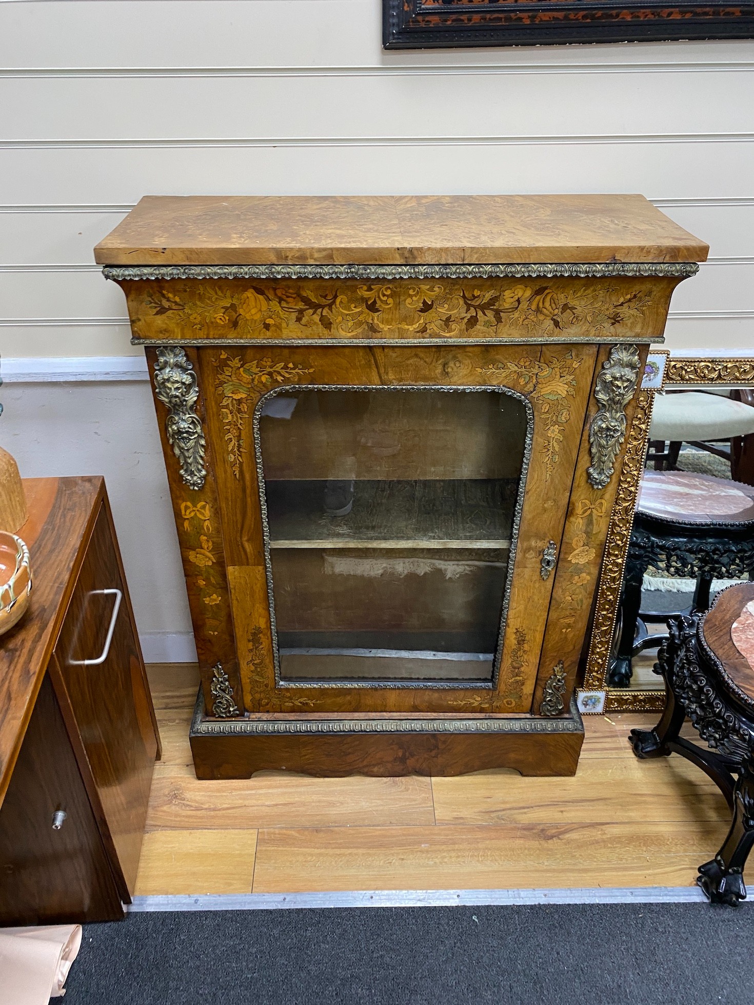 A pair of Victorian gilt metal mounted marquetry inlaid walnut pier cabinets, width 83cm, depth 31cm, height 115cm